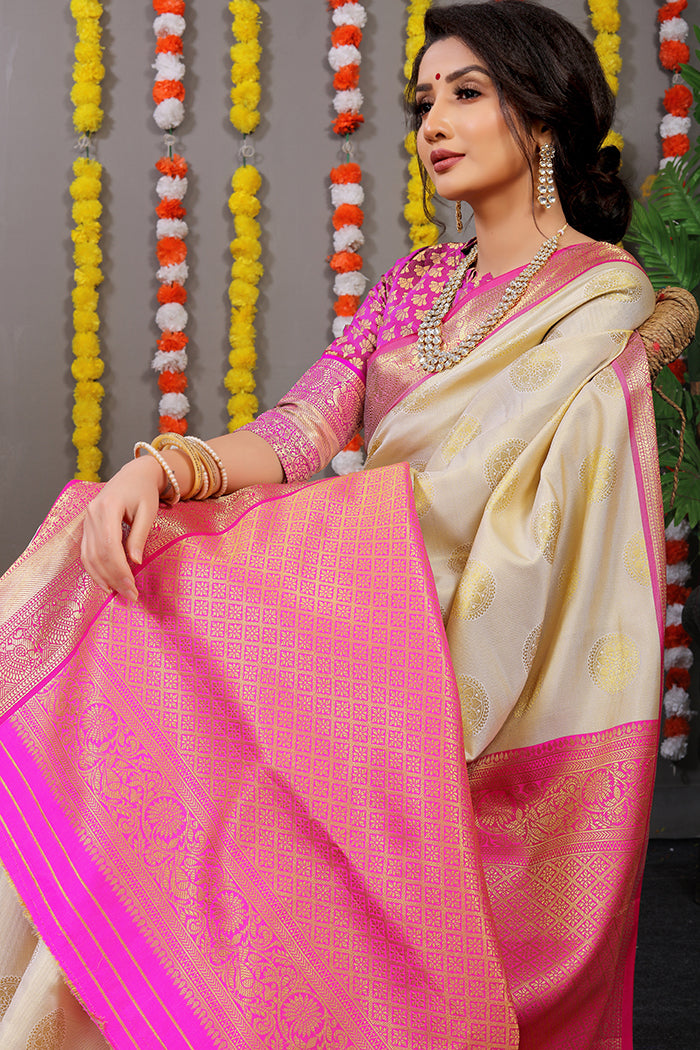 Elegant Cream & Rani Pink Banarasi Silk Saree with Golden Zari Work