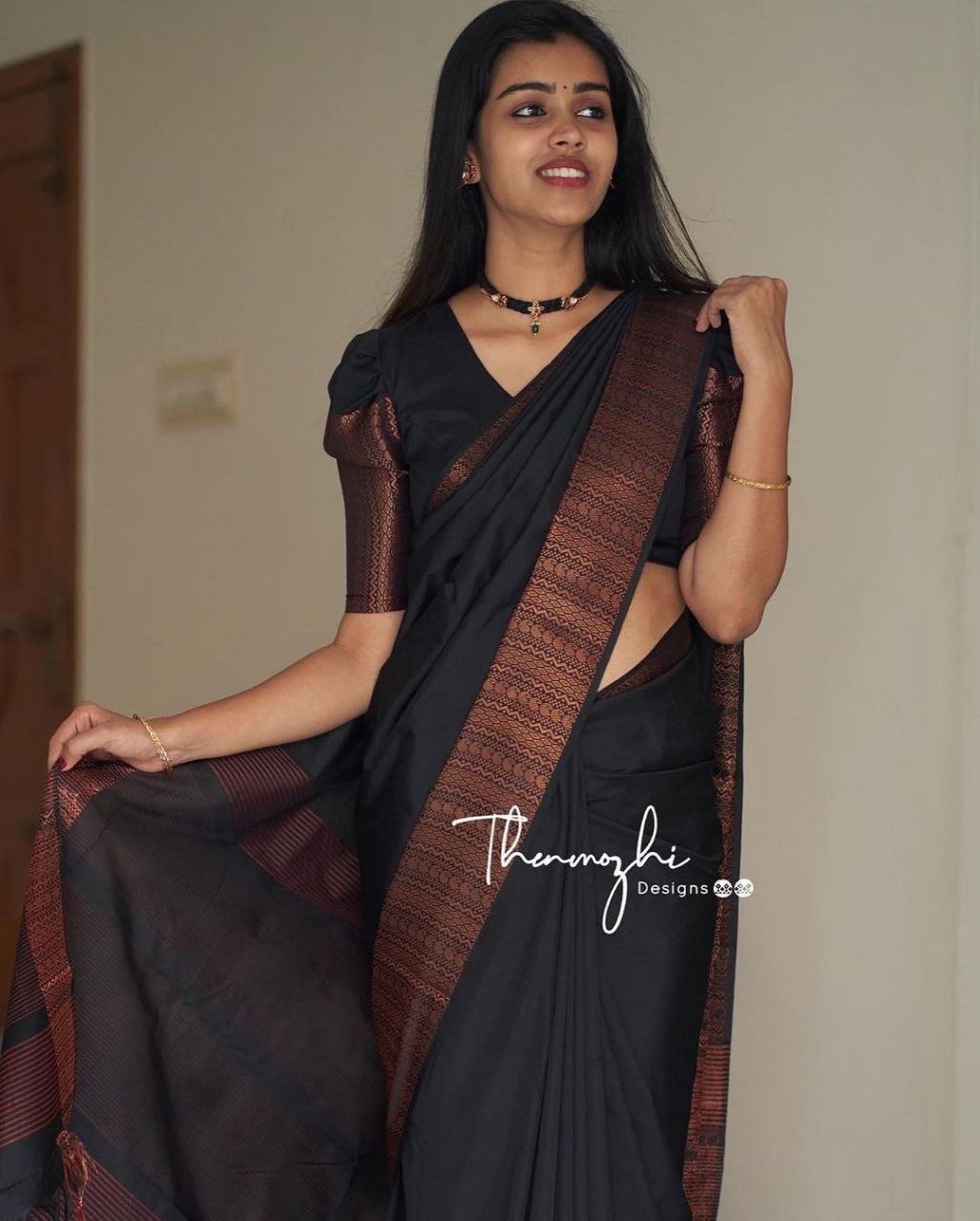 Kanjivarm Black saree With Copper Zari Border
