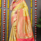 Yellow Banarasi Silk Saree with Gold Zari Work and Pink Border